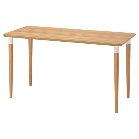 The space under the bamboo drawer is perfect for storing the keyboard just slide it in when not in use. . Ikea bamboo desk